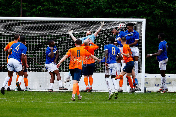 Football action from Diss Town vs FC Peterborough