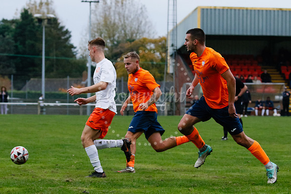 Football action from Diss Town hosting Holland FC.