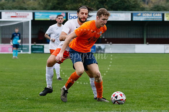Football action from Diss Town hosting Holland FC.