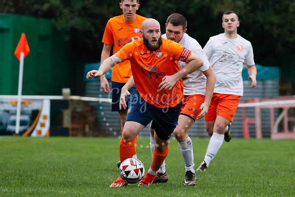 Football action from Diss Town hosting Holland FC.