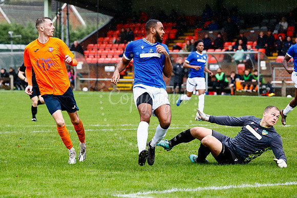 Football action from Diss Town vs FC Peterborough