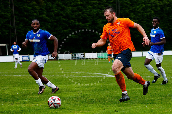 Football action from Diss Town vs FC Peterborough