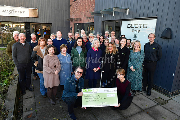 Gusto Community Fund charity cheque presentations