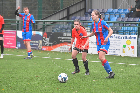 Newark Ladies (orange) v Grimsby football action