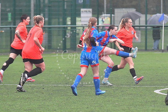 Newark Ladies (orange) v Grimsby football action