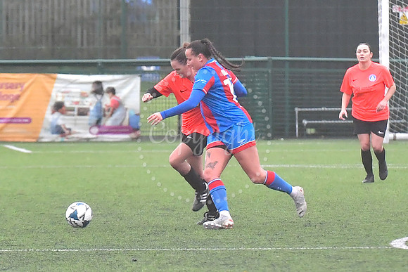 Newark Ladies (orange) v Grimsby football action
