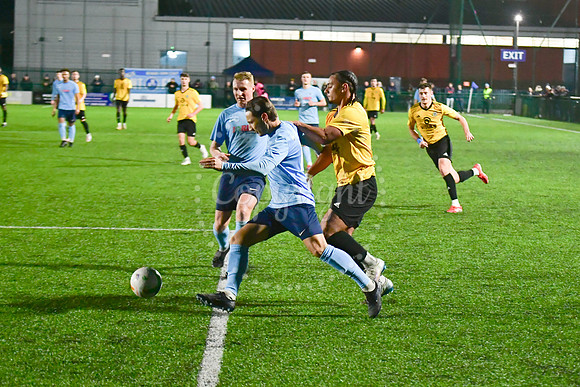 Newark Town (blue) v Harrowby United football (yellow) action