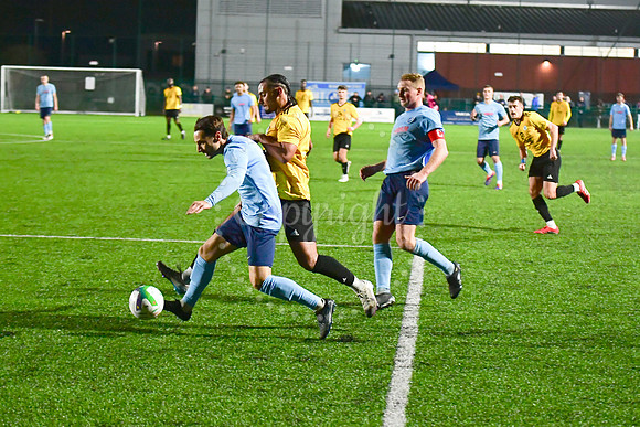Newark Town (blue) v Harrowby United football (yellow) action