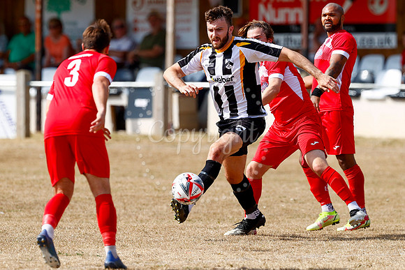 Football action from Harleston v Woodbridge