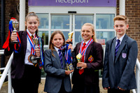 Harleston Sancroft Academy pupils with some of the medals and aw