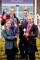 Harleston Sancroft Academy pupils with some of the medals and aw