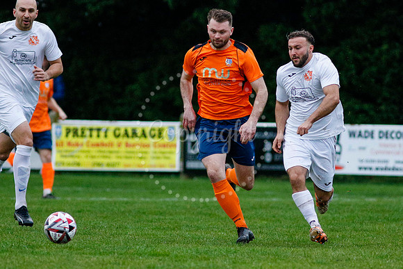 Football action from Diss Town vs Holland FC