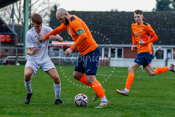 Football action from Diss Town vs Holland FC