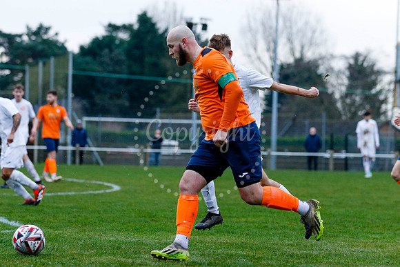 Football action from Diss Town vs Holland FC