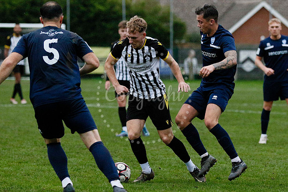 Football action from Harleston vs Bramtham Athletic