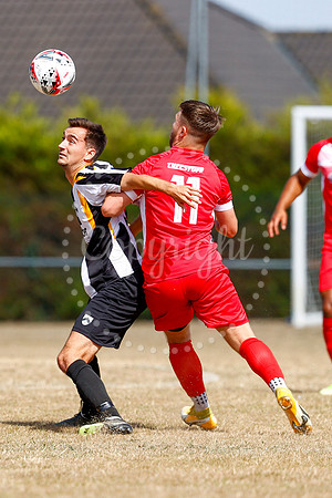 Football action from Harleston v Woodbridge