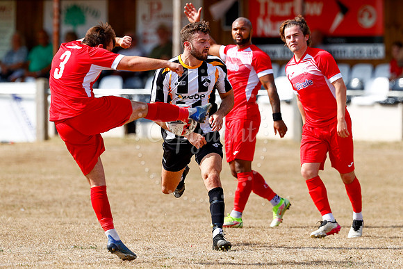 Football action from Harleston v Woodbridge