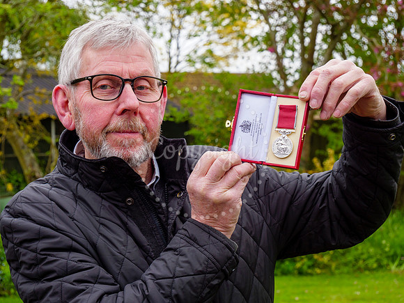 Framlingham shop owner Bill Bulstrode has been awarded a BEM med