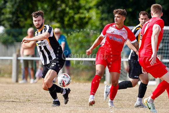 Football action from Harleston v Woodbridge