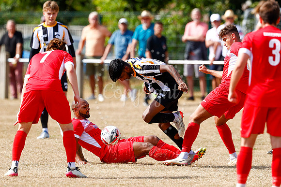 Football action from Harleston v Woodbridge