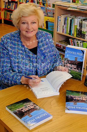 Baronness Elaine Murphy signing her book in Diss Publishing.