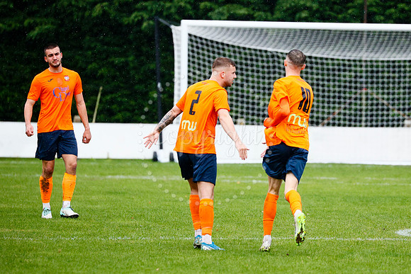 Football action from Diss Town vs FC Peterborough