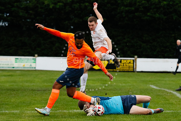 Football action from Diss Town hosting Holland FC.