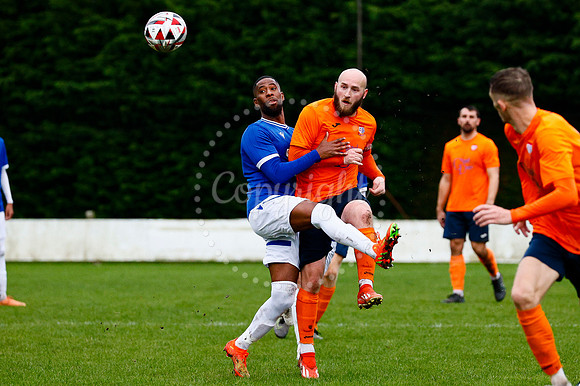 Football action from Diss Town vs FC Peterborough