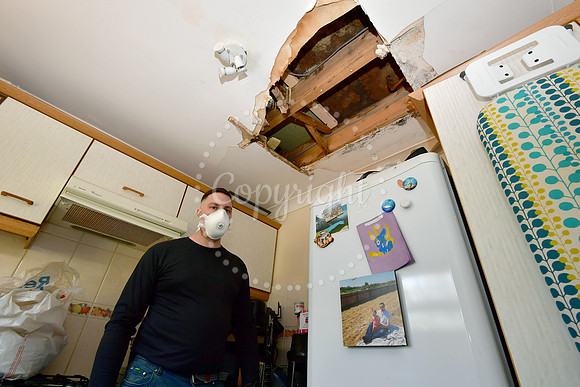 Carl Forster with his water damaged house