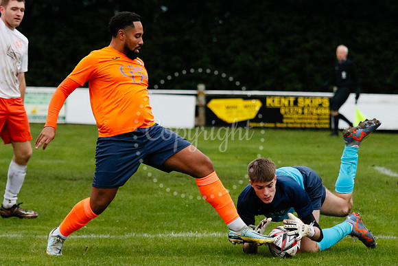 Football action from Diss Town hosting Holland FC.