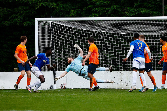 Football action from Diss Town vs FC Peterborough