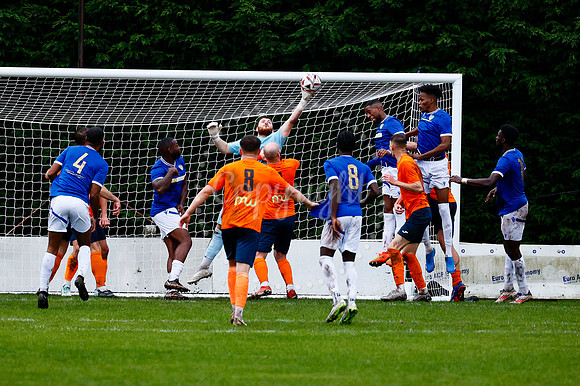 Football action from Diss Town vs FC Peterborough