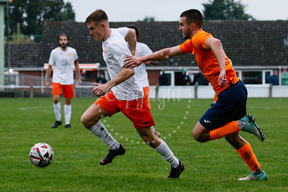 Football action from Diss Town hosting Holland FC.