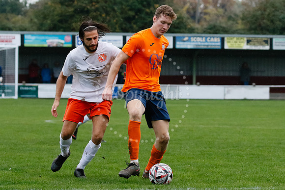 Football action from Diss Town hosting Holland FC.