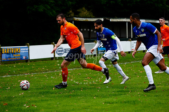 Football action from Diss Town vs FC Peterborough