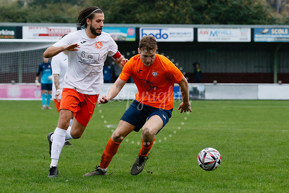 Football action from Diss Town hosting Holland FC.