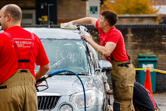 Staff from across Norfolk Fire & Rescue Service take part in a f