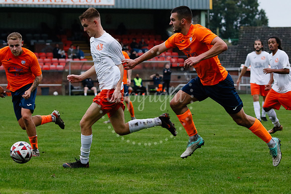 Football action from Diss Town hosting Holland FC.