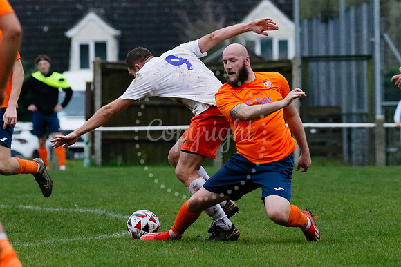 Football action from Diss Town hosting Holland FC.