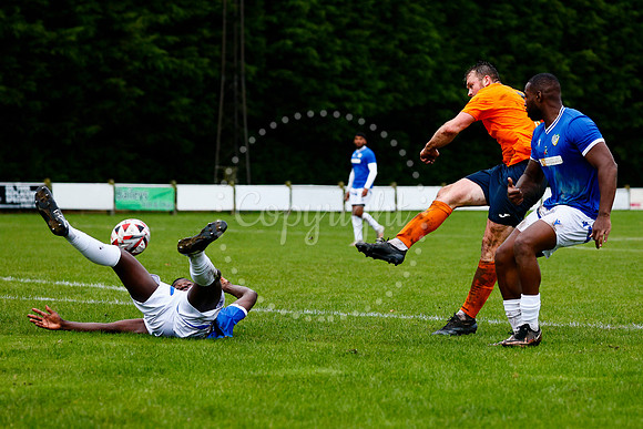 Football action from Diss Town vs FC Peterborough