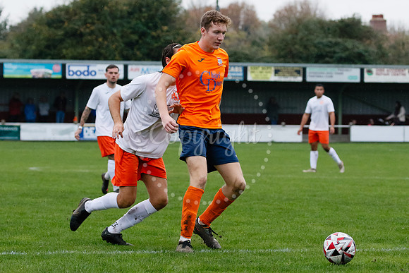 Football action from Diss Town hosting Holland FC.