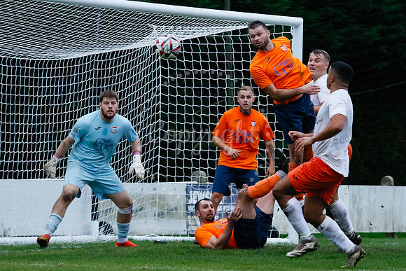 Football action from Diss Town hosting Holland FC.