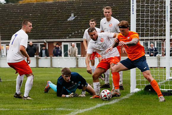 Football action from Diss Town hosting Holland FC.