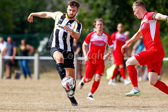 Football action from Harleston v Woodbridge