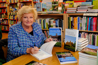 Baronness Elaine Murphy signing her book in Diss Publishing.