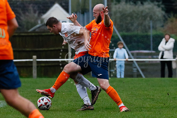 Football action from Diss Town hosting Holland FC.