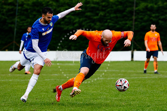 Football action from Diss Town vs FC Peterborough