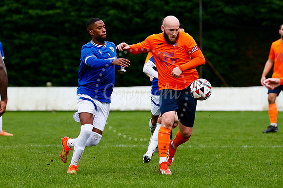 Football action from Diss Town vs FC Peterborough