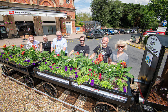 BFP Outside Bury St Edmunds train stationMini train with flowers by Bury in Bloom outside the train station, picture of it with members of Bury in Bloom. Picture by Mark Westley