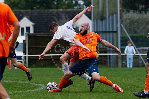 Football action from Diss Town hosting Holland FC.